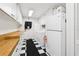 Well-organized laundry area featuring a refrigerator, washer and dryer, and ample storage at 2221 Oak Hill Dr, Deland, FL 32720