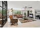 Open living room with a brown sectional, tile floors, and neutral wall paint at 2221 Oak Hill Dr, Deland, FL 32720
