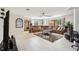 Spacious living room with a tile floor, and a cozy, oversized sectional sofa at 2221 Oak Hill Dr, Deland, FL 32720