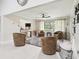 Bright, airy living room with plush seating, ceiling fan, and modern decor at 2221 Oak Hill Dr, Deland, FL 32720