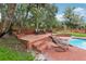 Inviting backyard with a private pool, brick patio, and lounge chairs at 2221 Oak Hill Dr, Deland, FL 32720