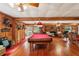 Recreation room features a pool table, ample seating, and unique decor at 2221 Oak Hill Dr, Deland, FL 32720