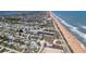 Aerial view of beachside community with oceanfront condos and residential neighborhoods at 2222 Ocean Shore Blvd # 304B, Ormond Beach, FL 32176