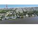 Expansive aerial view of a coastal community with waterfront homes and ocean access at 2222 Ocean Shore Blvd # 304B, Ormond Beach, FL 32176