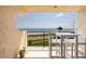 Outdoor balcony featuring white patio furniture with an expansive ocean view at 2222 Ocean Shore Blvd # 304B, Ormond Beach, FL 32176