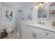 Modern bathroom with marble walk-in shower, updated vanity and stylish lighting at 2222 Ocean Shore Blvd # 304B, Ormond Beach, FL 32176