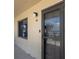 Exterior view of front door and window with unit number at beach condo at 2222 Ocean Shore Blvd # 304B, Ormond Beach, FL 32176