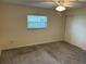 Bright bedroom with carpet and a window, offering a calm and inviting atmosphere at 233 Elmwood Ave # 290, Deland, FL 32724