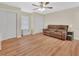 Spacious bedroom with wood flooring, a ceiling fan, and a double-door closet at 241 Bayou Vista St, Debary, FL 32713