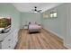 Comfortable bedroom with wood floors and neutral walls, featuring a double window at 241 Bayou Vista St, Debary, FL 32713