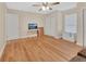 Spacious bedroom features wood floors, a ceiling fan, and ample natural light at 241 Bayou Vista St, Debary, FL 32713