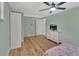 Charming bedroom with wood floors, ceiling fan, and ample storage at 241 Bayou Vista St, Debary, FL 32713