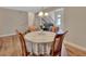 Bright dining area showing hardwood floors, and view into the adjacent living area at 241 Bayou Vista St, Debary, FL 32713