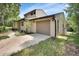 Charming two-story home featuring an attached garage and well-maintained lawn at 241 Bayou Vista St, Debary, FL 32713