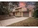 Charming two-story home featuring an attached garage and mature trees in a serene setting at 241 Bayou Vista St, Debary, FL 32713