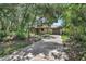 Exterior view of home featuring garage and a long driveway at 241 Bayou Vista St, Debary, FL 32713