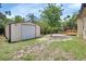 Exterior view of detached garage with roll up door at 241 Bayou Vista St, Debary, FL 32713