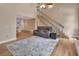 Bright open-concept living space with hardwood floors and stairs to the second level at 241 Bayou Vista St, Debary, FL 32713