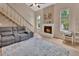 Spacious living room with brick fireplace and large windows for natural light at 241 Bayou Vista St, Debary, FL 32713