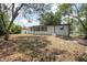 Rear exterior view of the home with large, grassy backyard at 2434 Barbarossa Ave, Deltona, FL 32738