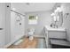 Bright bathroom featuring a walk-in shower, dual vanity, and modern fixtures at 2434 Barbarossa Ave, Deltona, FL 32738
