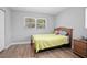Neutral bedroom with wood-look floors and a sunny window at 2434 Barbarossa Ave, Deltona, FL 32738