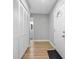Bright entryway boasts wood-look floors, hall closet, and door to bathroom at 2434 Barbarossa Ave, Deltona, FL 32738
