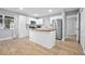 Bright kitchen featuring white cabinets, stainless steel appliances, and a butcher block island at 2434 Barbarossa Ave, Deltona, FL 32738
