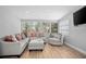 Cozy living room with a neutral color palette, comfortable seating, and natural light at 2434 Barbarossa Ave, Deltona, FL 32738