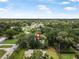 A property nestled among trees, showcasing the surrounding neighborhood and highlighting the home's private, tree-lined location at 2509 Kumquat Dr, Edgewater, FL 32141