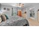 Inviting bedroom featuring soft carpeting, a comfortable bed, and natural light from the window at 2509 Kumquat Dr, Edgewater, FL 32141