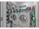 Efficient laundry room with modern appliances, storage solutions, and functional design at 2509 Kumquat Dr, Edgewater, FL 32141
