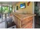 Covered patio area, perfect for relaxing and entertaining with a built-in bar at 2509 Kumquat Dr, Edgewater, FL 32141