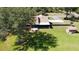 Expansive property with a charming brick home, a separate shed, and a well-maintained lawn with mature trees at 2699 Audubon Ave, Deland, FL 32720