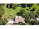 Well-maintained property with a pond, shed, lush lawn and mature trees, offering privacy and natural beauty at 2699 Audubon Ave, Deland, FL 32720