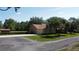 Charming brick home with attached garage, well-maintained landscaping, and a long driveway for ample parking at 2699 Audubon Ave, Deland, FL 32720
