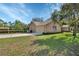 Brick home with a two-car garage, well-manicured lawn, and curb appeal at 2699 Audubon Ave, Deland, FL 32720