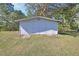 Spacious detached garage with double doors and ample storage space at 2699 Audubon Ave, Deland, FL 32720