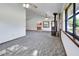 Open-concept living room with views into the kitchen and featuring a cozy wood-burning stove at 2699 Audubon Ave, Deland, FL 32720
