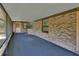 This covered patio features a brick exterior and offers an outdoor living space at 2699 Audubon Ave, Deland, FL 32720
