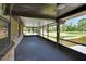 Spacious screened-in porch with views of the large yard, brick exterior, and adjacent outdoor space at 2699 Audubon Ave, Deland, FL 32720