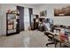 Comfortable room with tiled floor, featuring shelving, desk, gaming chair, and poster decorations at 272 Sunrise Blvd, Debary, FL 32713