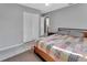 Cozy bedroom with closet and tiled floor, featuring a comfortable bed with colorful quilt at 272 Sunrise Blvd, Debary, FL 32713