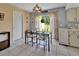 Bright dining area with glass table, tile floors and bright light from the backyard at 272 Sunrise Blvd, Debary, FL 32713