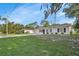 Charming single-story home with fresh white paint, dark shutters, and a well-manicured lawn, perfect for curb appeal at 272 Sunrise Blvd, Debary, FL 32713