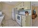Well-equipped kitchen with sleek appliances, bright white cabinets, and easy access to the dining area at 272 Sunrise Blvd, Debary, FL 32713