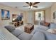 Relaxing living room, tile floor, ceiling fan, natural light, view of front yard and comfortable seating at 272 Sunrise Blvd, Debary, FL 32713