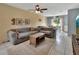 Inviting living room offering tile floors, ceiling fan, natural light and a view to the backyard at 272 Sunrise Blvd, Debary, FL 32713
