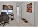 Home office features desk with computer, a rolling office chair, tiled floor, and fun wall decor at 272 Sunrise Blvd, Debary, FL 32713