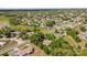 An aerial view of a residential neighborhood with tree-lined streets and single-Gathering homes at 2885 Newmark Dr, Deltona, FL 32738
